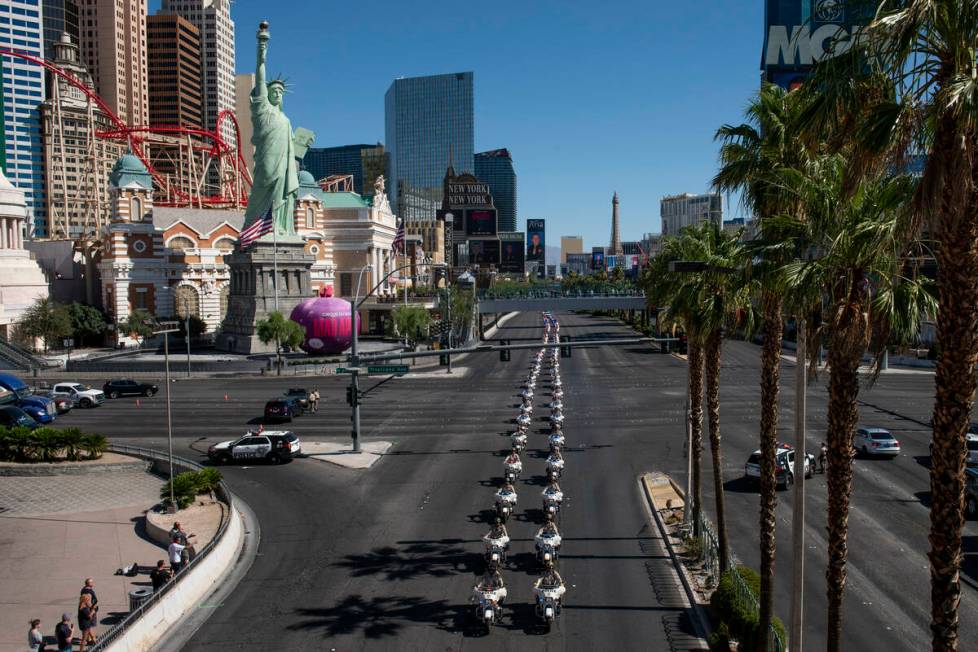 The funeral procession for Las Vegas police Detective Justin Terry heads south on Las Vegas Bou ...