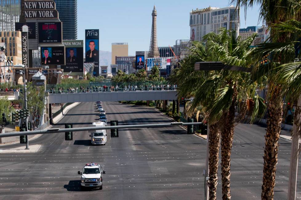 The funeral procession for Las Vegas police Detective Justin Terry heads south on Las Vegas Bou ...