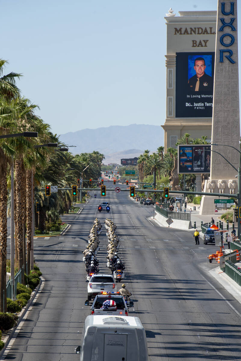 The funeral procession for Las Vegas police Detective Justin Terry heads south on Las Vegas Bou ...