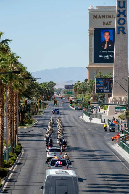 The funeral procession for Las Vegas police Detective Justin Terry heads south on Las Vegas Bou ...