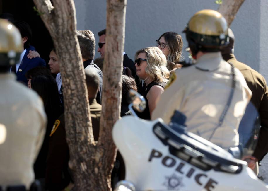 Family members of Las Vegas police Detective Justin Terry watch as a Metropolitan Police Depart ...