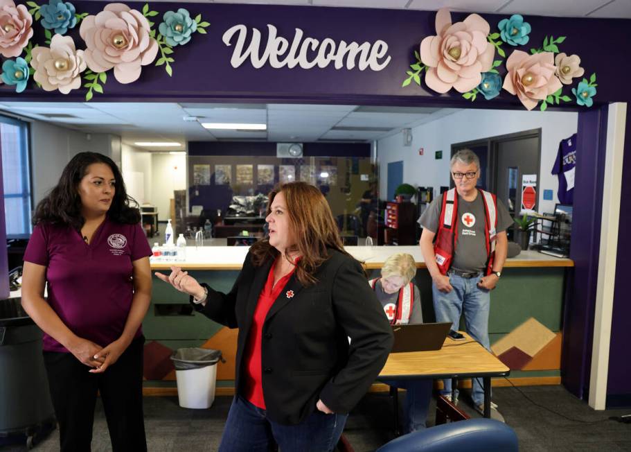 Las Vegas City Councilwoman Olivia Diaz, left, tours an assistance center with Rachel Flanigan, ...