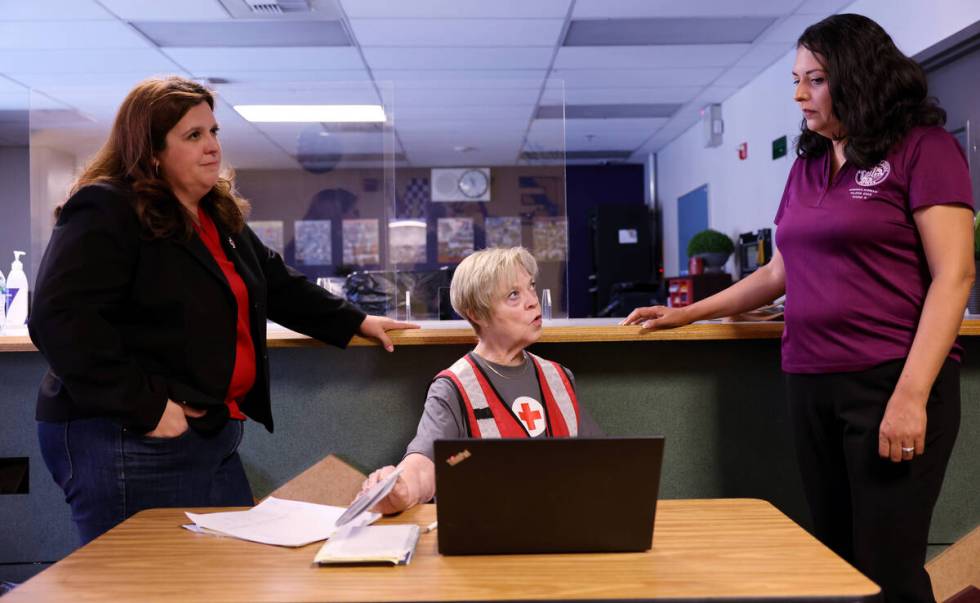 Las Vegas City Councilwoman Olivia Diaz, right, tours an assistance center with Rachel Flanigan ...