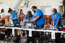 Election workers process boxes of ballots at the Clark County Election Department in North Las ...