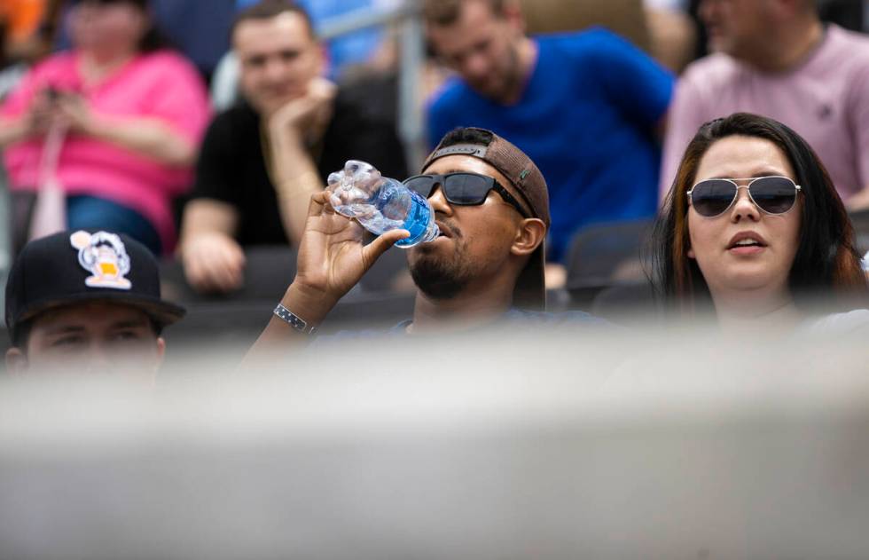 Fans try and stay cool during a minor league baseball game between the Aviators and the Salt La ...