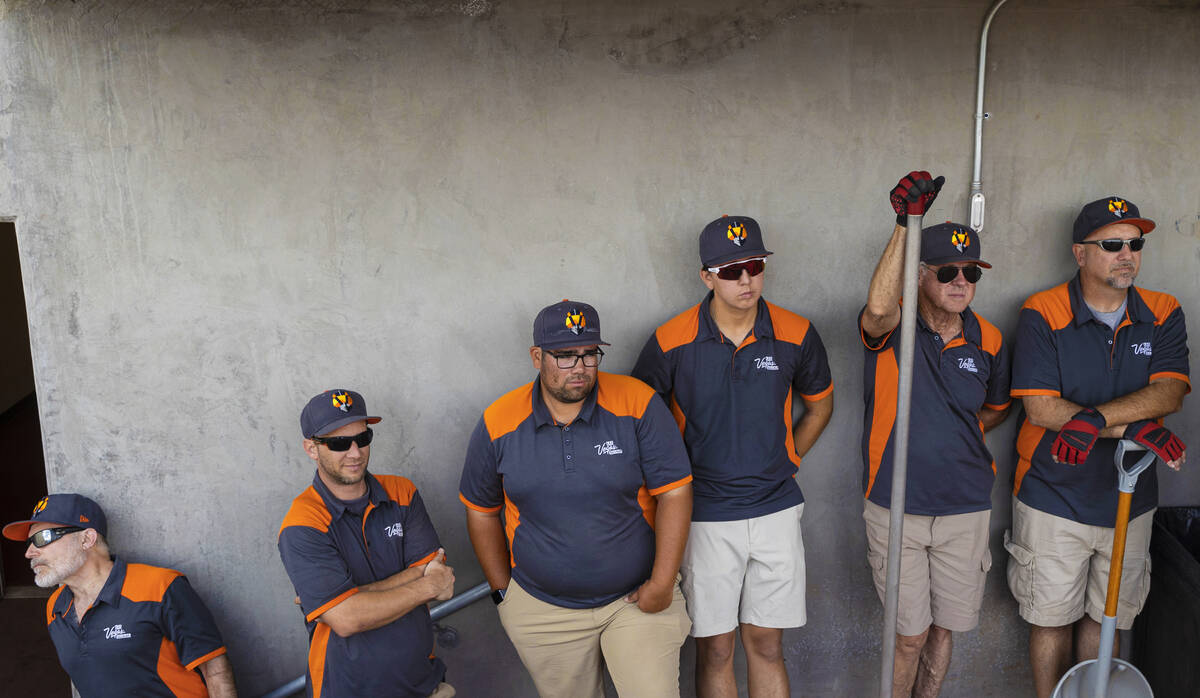 The Aviators ground crew waits to take the field during a minor league baseball game against th ...
