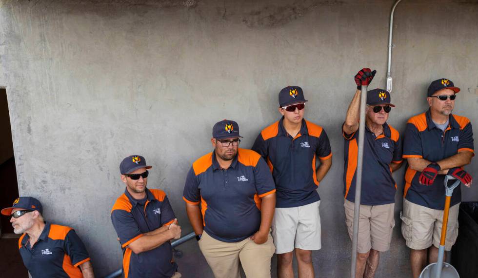 The Aviators ground crew waits to take the field during a minor league baseball game against th ...