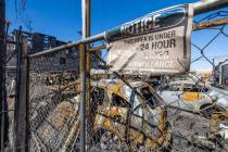 Burned out cars on the lot at Perfect Auto Body after a fire swept from stalled construction at ...