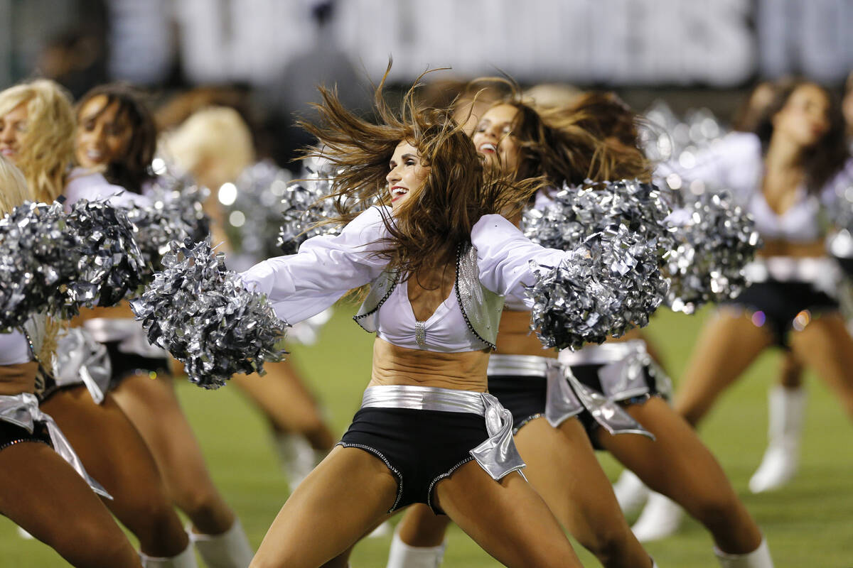 Raiders cheerleader Lacy Fields performs during a game against the Chicago Bears on Friday, Aug ...