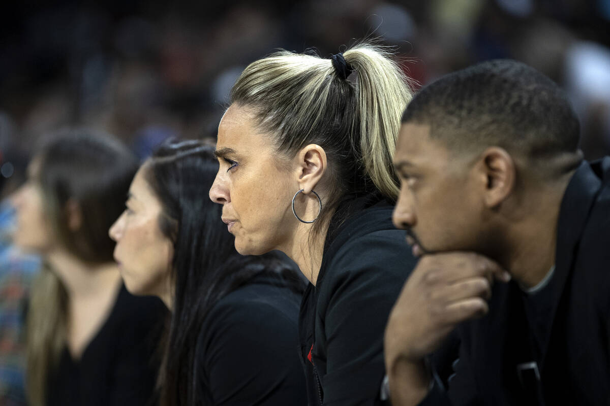 Las Vegas Aces coaching staff including head coach Becky Hammon, center right, express disappoi ...