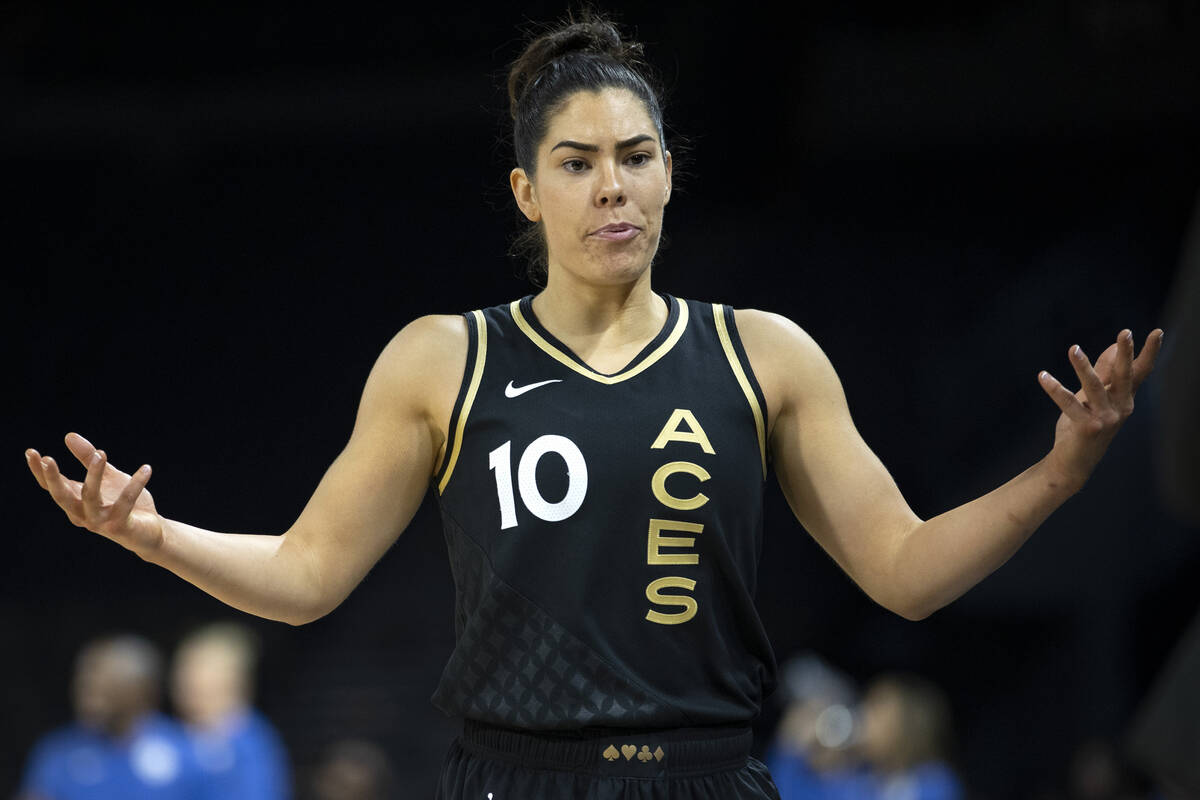 Las Vegas Aces guard Kelsey Plum (10) reacts as head coach Becky Hammon benches her during the ...