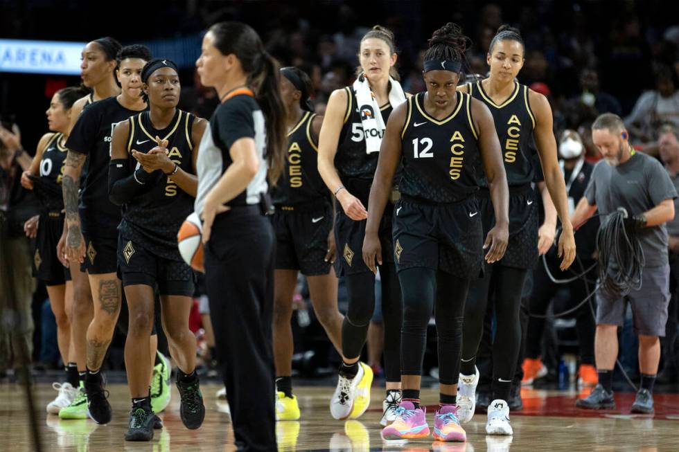 The Las Vegas Aces walk for their team huddle after losing a WNBA basketball game to the Chicag ...