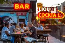 The outside patio begins to fill up with patrons for the start of the Atomic Liquors 70th anniv ...