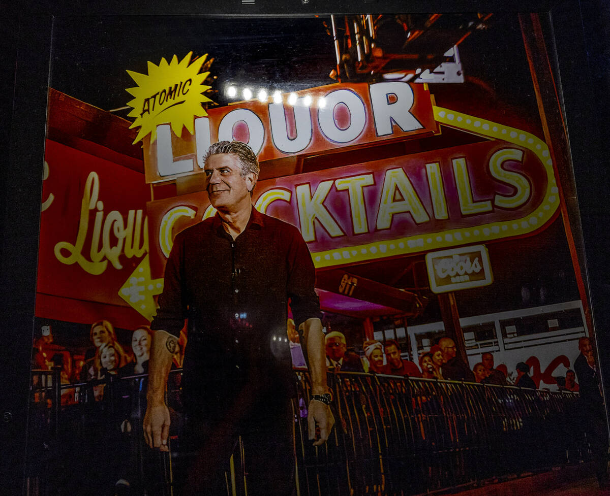 A poster of Anthony Bourdain hangs near the bar commemorating his visit to Atomic Liquors, the ...