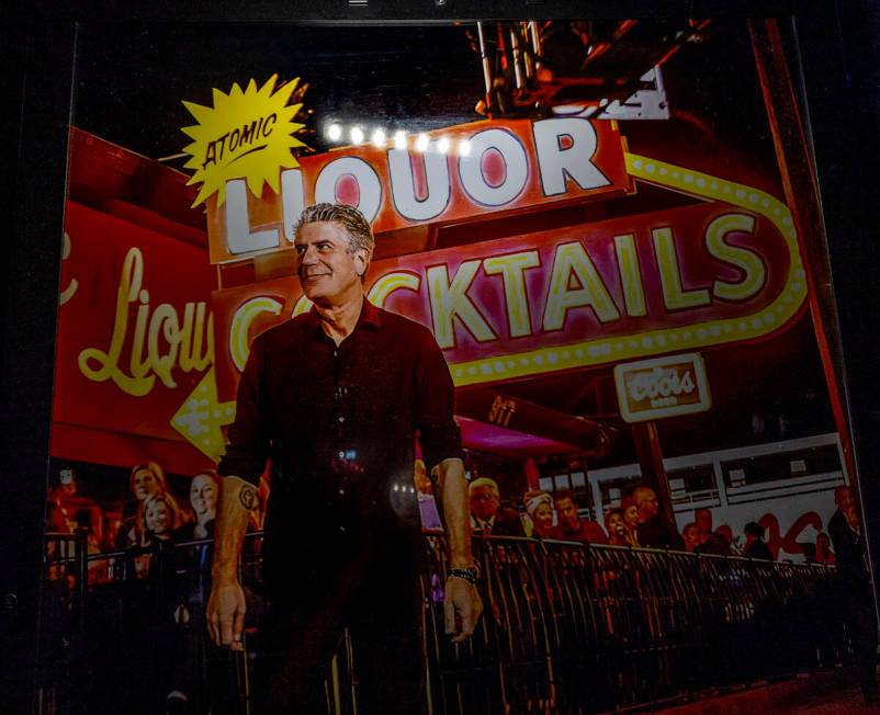 A poster of Anthony Bourdain hangs near the bar commemorating his visit to Atomic Liquors, the ...