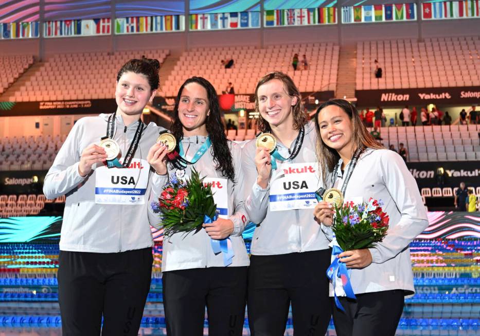 Gold medalist team of United States pose with their medals after the women's 4x200-meter freest ...