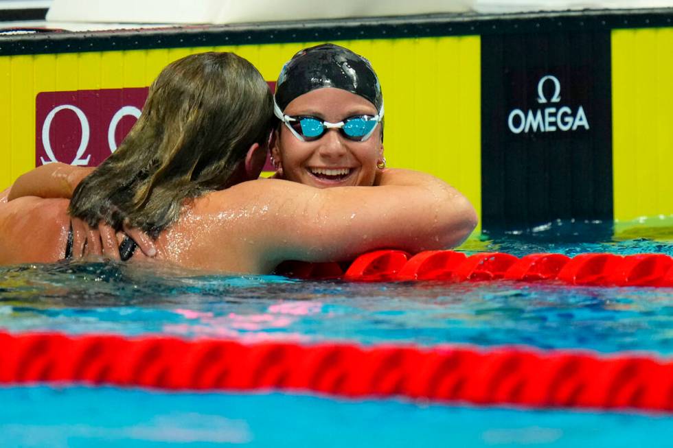 Second place Katie Grimes of the United States and Las Vegas celebrates with winner Katie Ledec ...