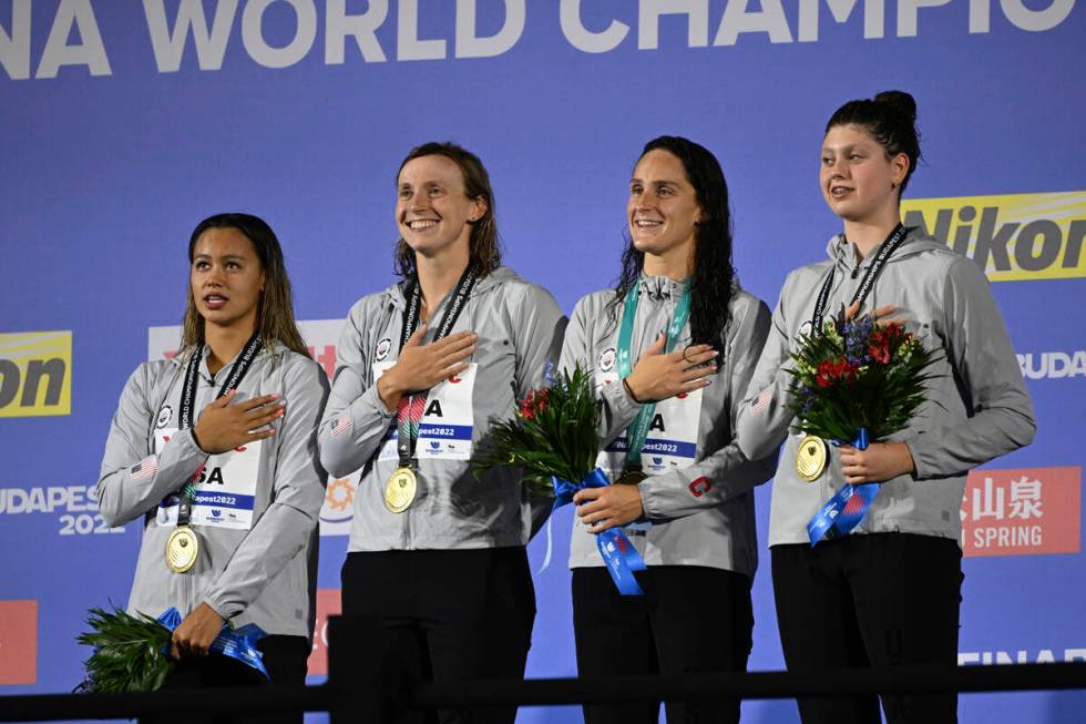 Gold medalist team of United States pose with their medals after the women's 4x200-meter freest ...