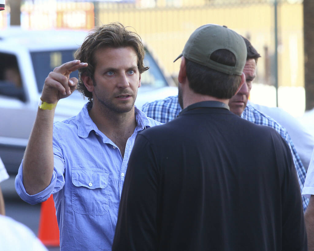 Bradley Cooper, star of the movie "The Hangover," talks with Director of Photography Lawrence S ...