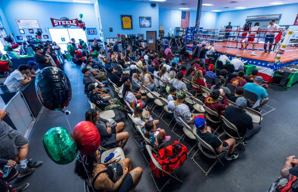 Attendees enjoy watching the fight action during the 2nd Annual Juneteenth Classic! boxing exhi ...