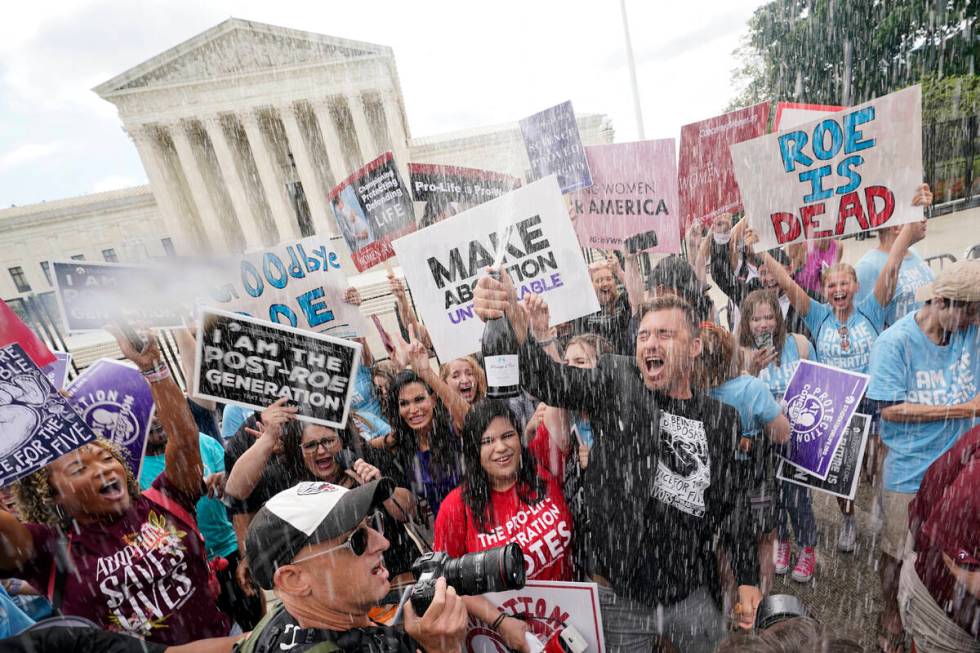 A celebration outside the Supreme Court, Friday, June 24, 2022, in Washington. The Supreme Cour ...