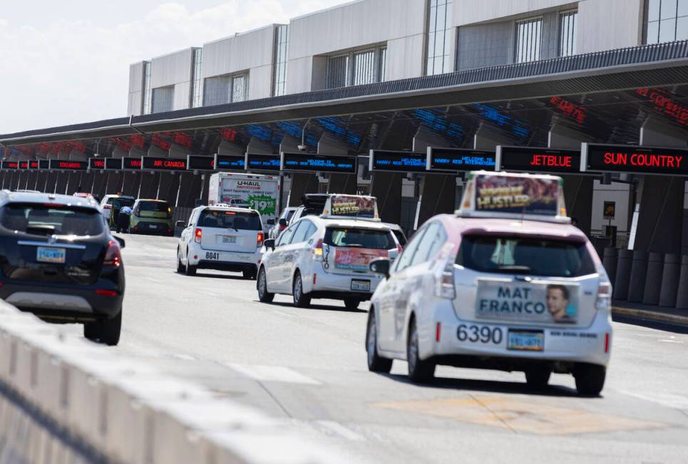 Departing passengers arrive at Terminal 3 at Harry Reid International Airport on Friday, June 2 ...