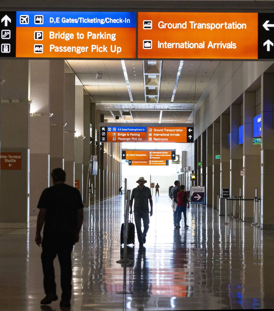 Passengers walk at Terminal 3 at Harry Reid International Airport on Friday, June 24, 2022, in ...