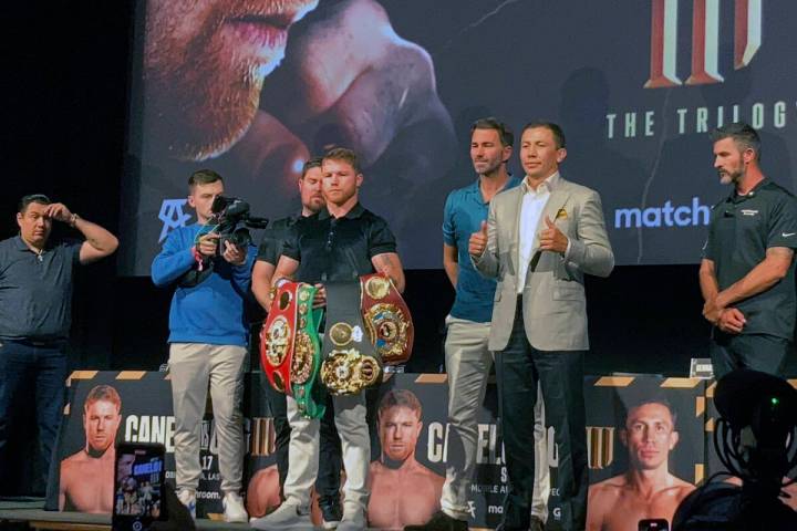 Saul "Canelo" Alvarez holds his belts while posing with opponent Gennadiy Gennadyevic ...