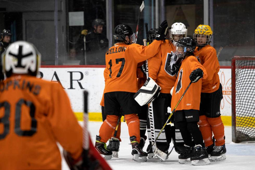 The Miners congratulate their goaltender after winning a 14U Jr. Golden Knights Hockey League g ...