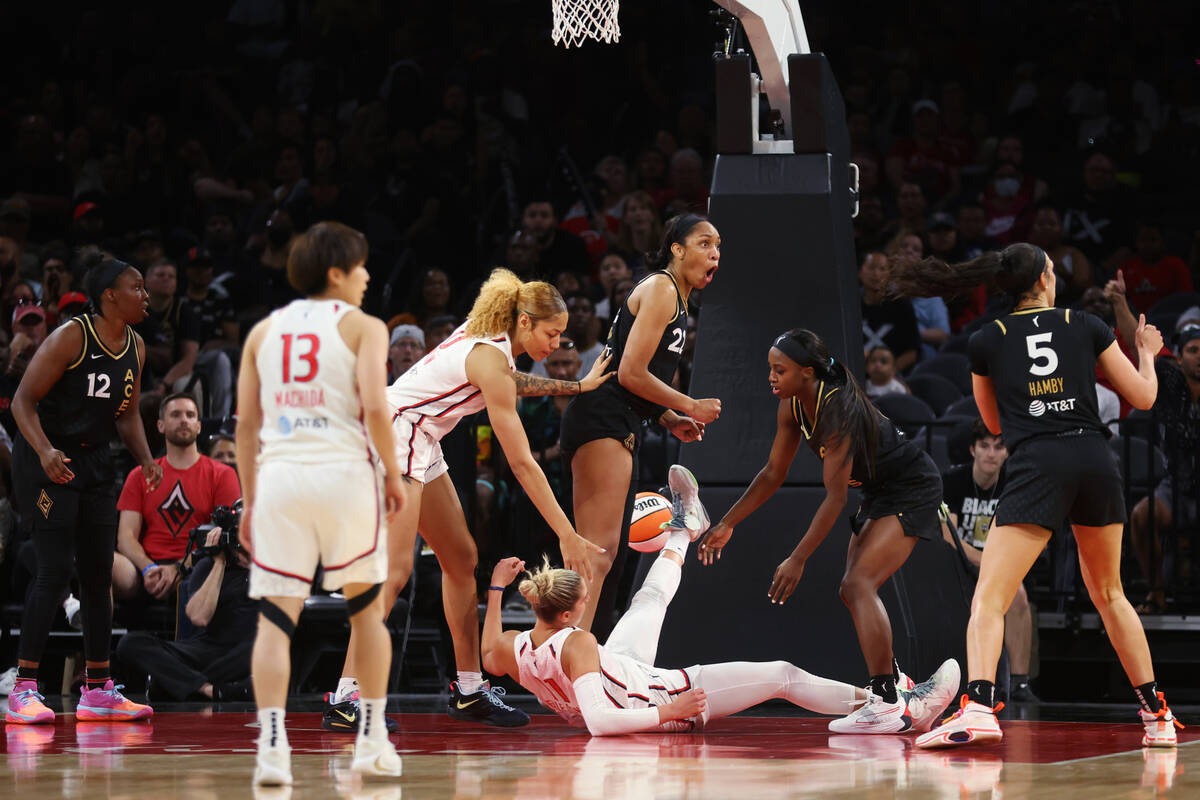 Las Vegas Aces and Washington Mystics players fight for the ball during the second half of a WN ...