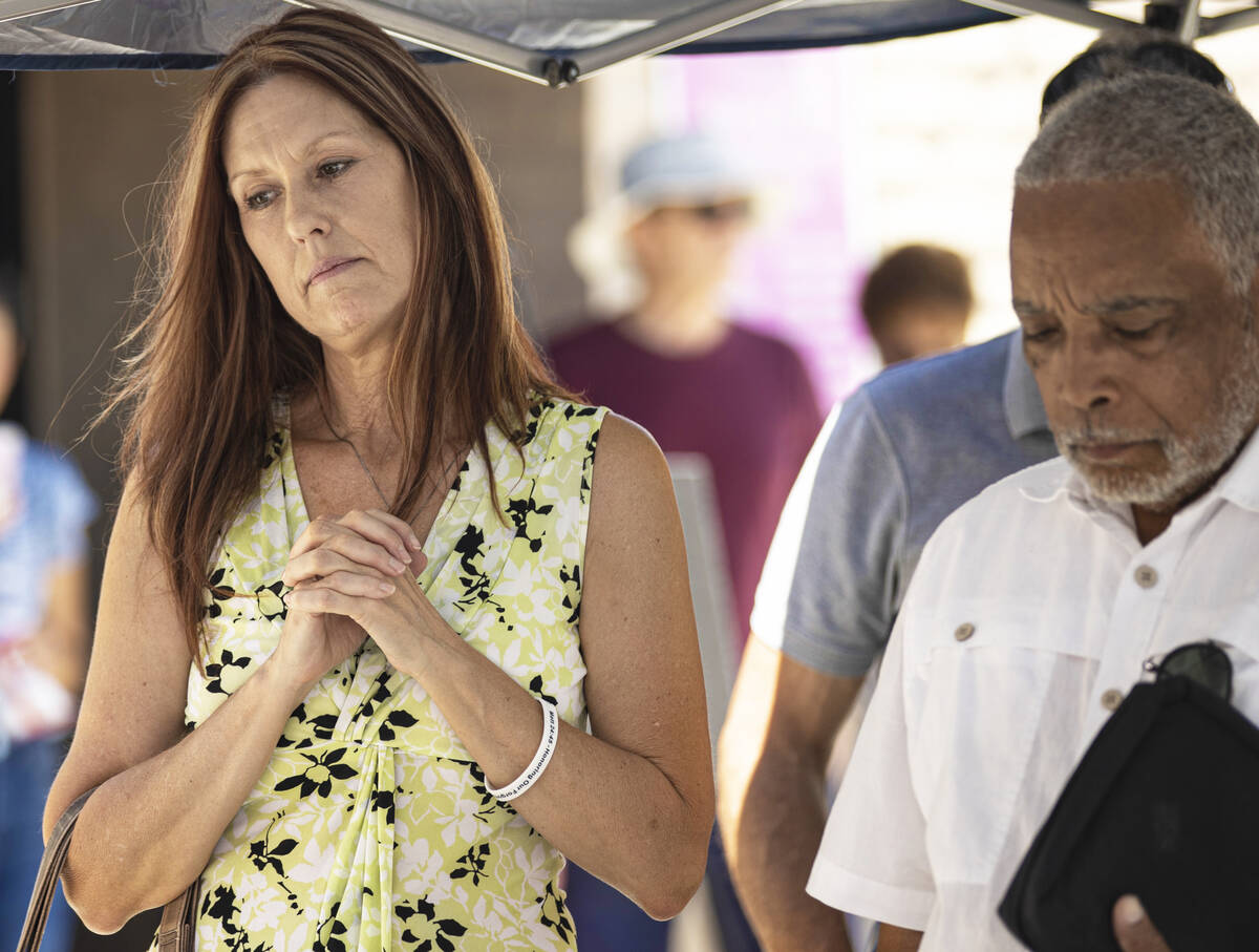 Candi Marshall, left, listens to a speaker while praying during the anti-abortion rally &#x201c ...