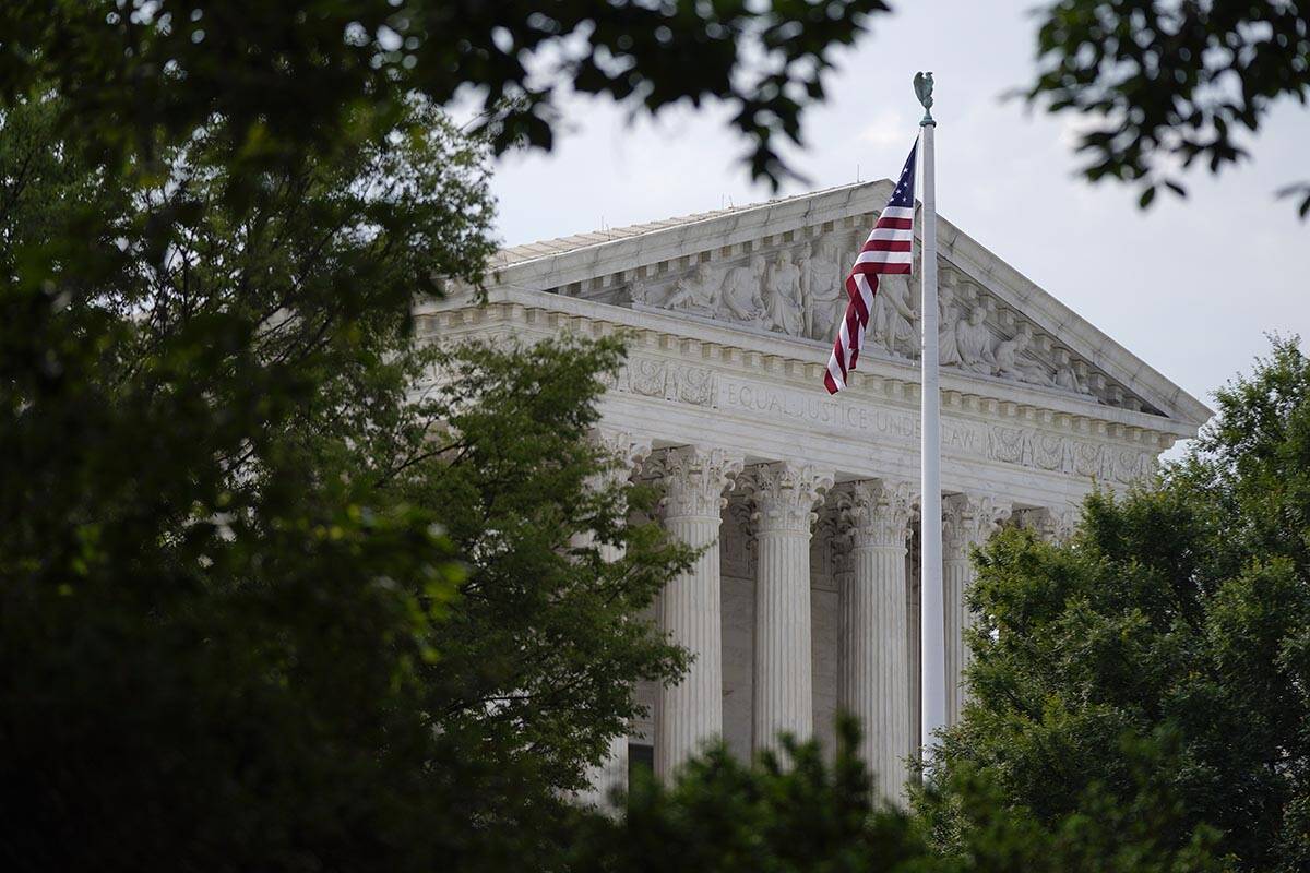 An American flag waves in front of the U.S. Supreme Court building, Monday, June 27, 2022, in W ...