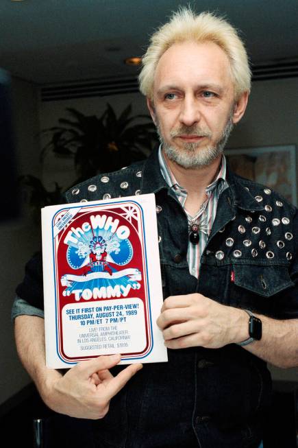 John Entwistle of The Who holds a poster on July 5, 1989, in New York for his group's upcoming ...