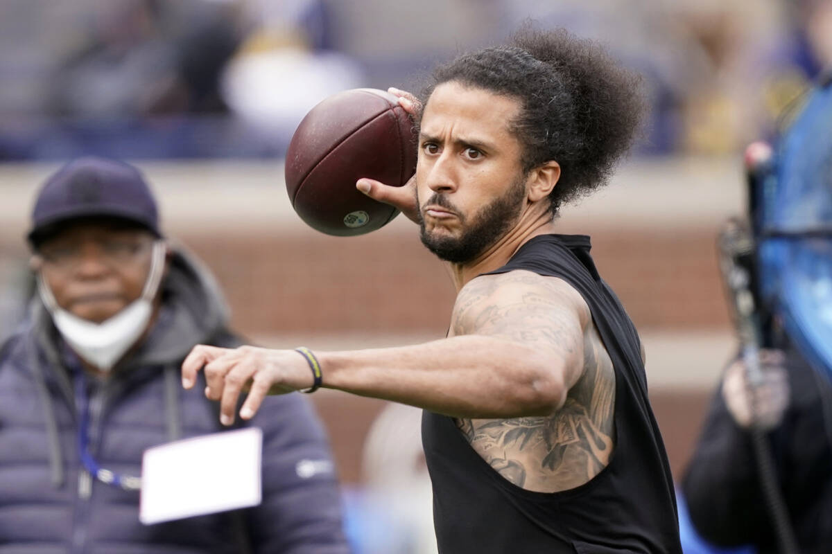 Colin Kaepernick throws during halftime of an NCAA college football intrasquad spring game at M ...