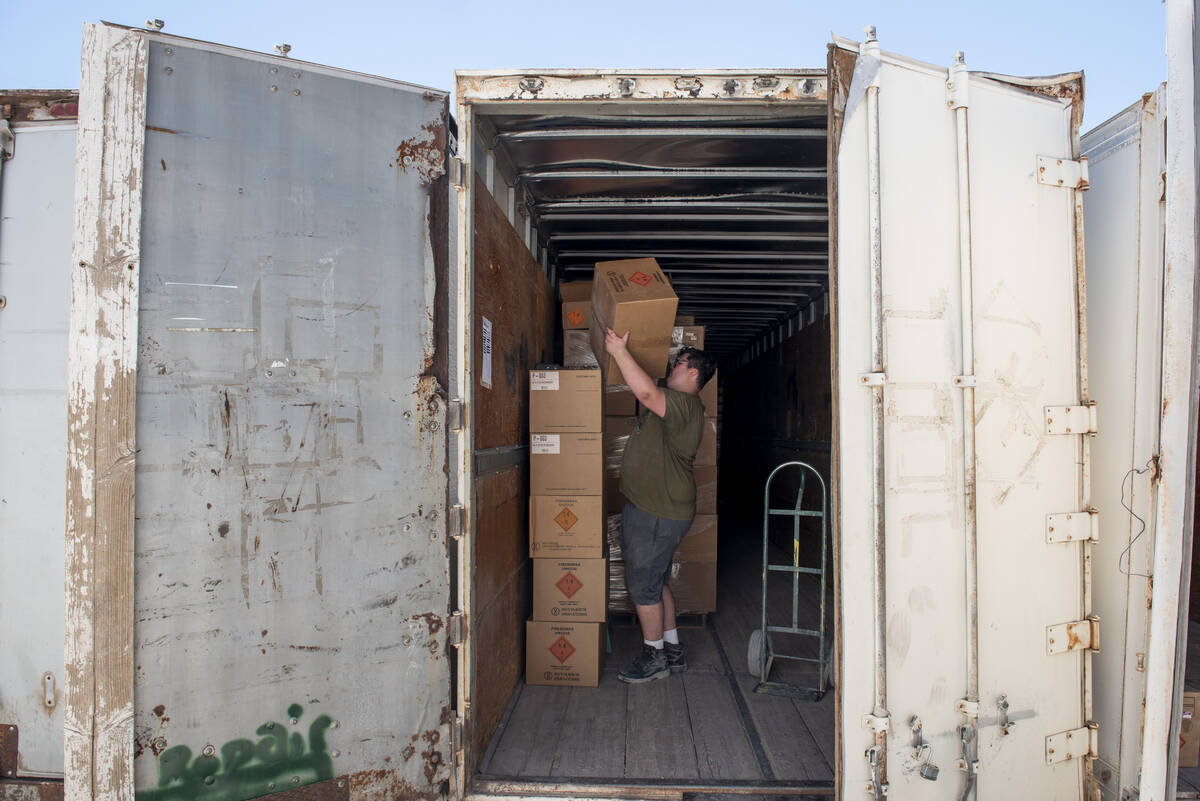 James Woodin organizes boxes in a trailer at the Phantom Fireworks warehouse to prepare for th ...