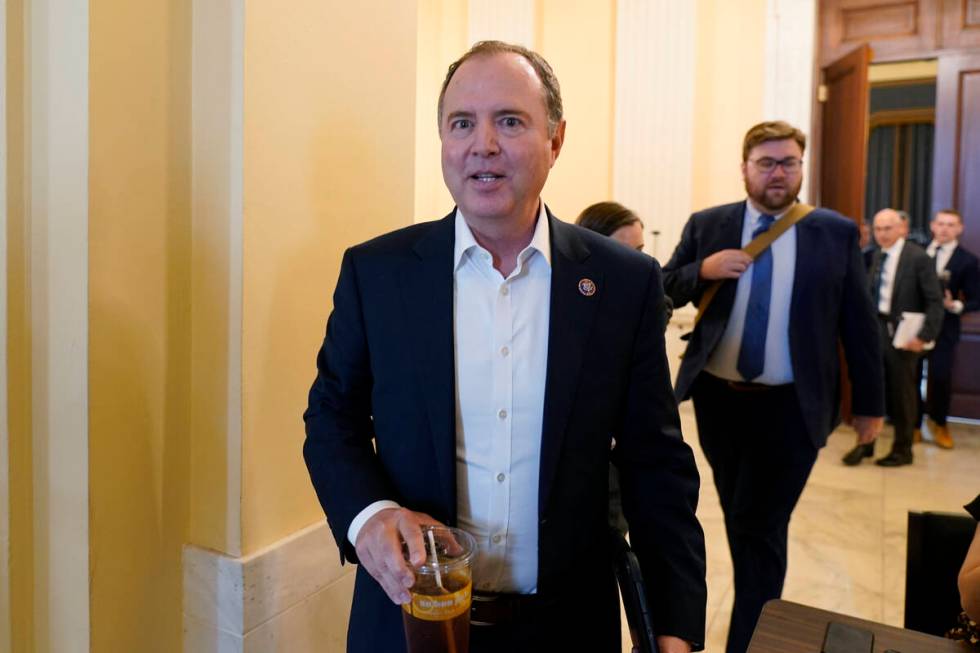Rep. Adam Schiff, D-Calif., leaves the hearing room after preparing for today's hearing, as the ...