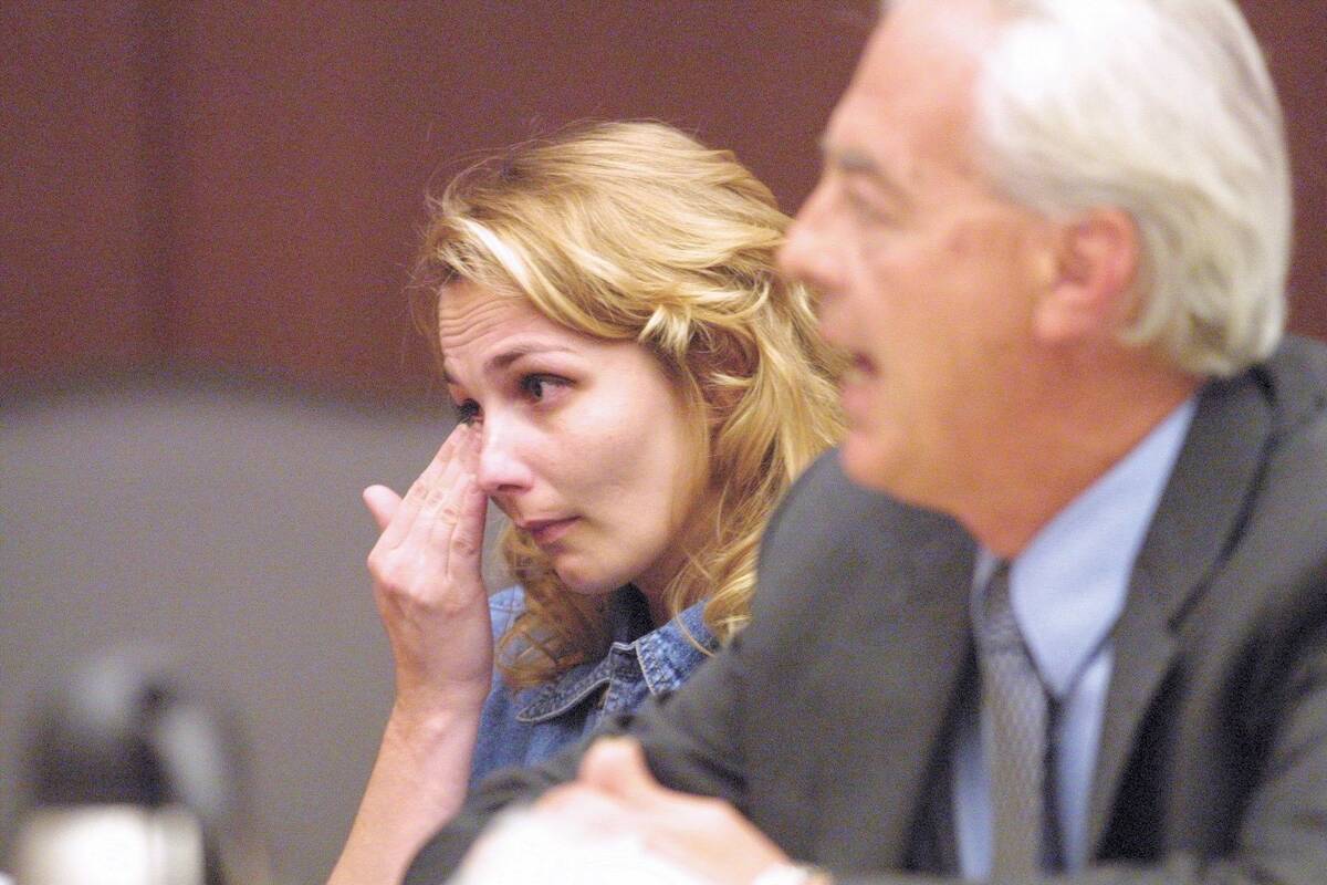 Sandy Shaw listens to her attorney William Terry talk to the Nevada Board of Pardons at the Sup ...