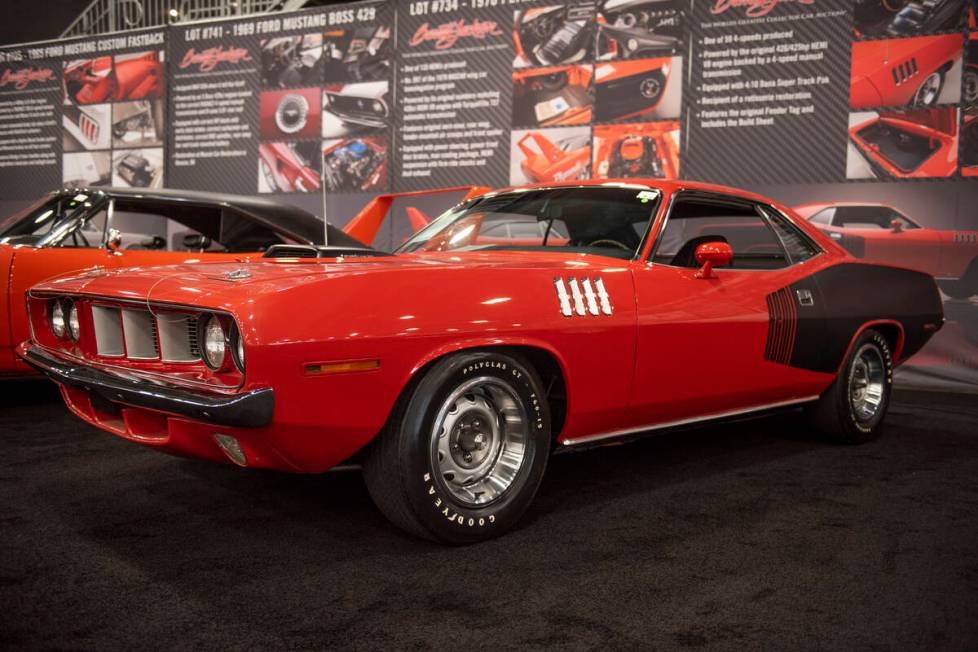 A 1971 Plymouth Hemi 'Cuda, one of only 59 4-speeds made, sits on the floor for the Barrett-Jac ...