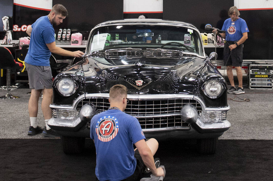 Workers for Adams Polishes detail a 1955 Cadillac Coupe during the set-up for the Barrett-Jacks ...