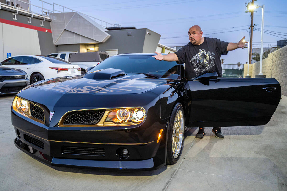 Gabriel Iglesias is shown with is 2015 Chevrolet Camaro Trans Am Bandit Edition. The car is for ...