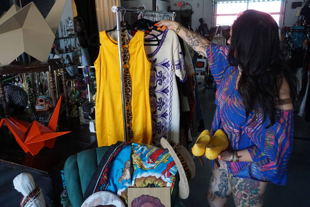 Ruby Romero shows some of the vintage items that she carries in Sin Amor Studio in the Arts Dis ...