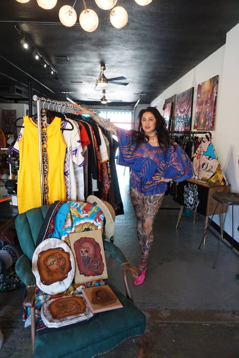 Ruby Romero poses next to a selection of vintage clothes in Sin Amor Studio in the Arts Distric ...