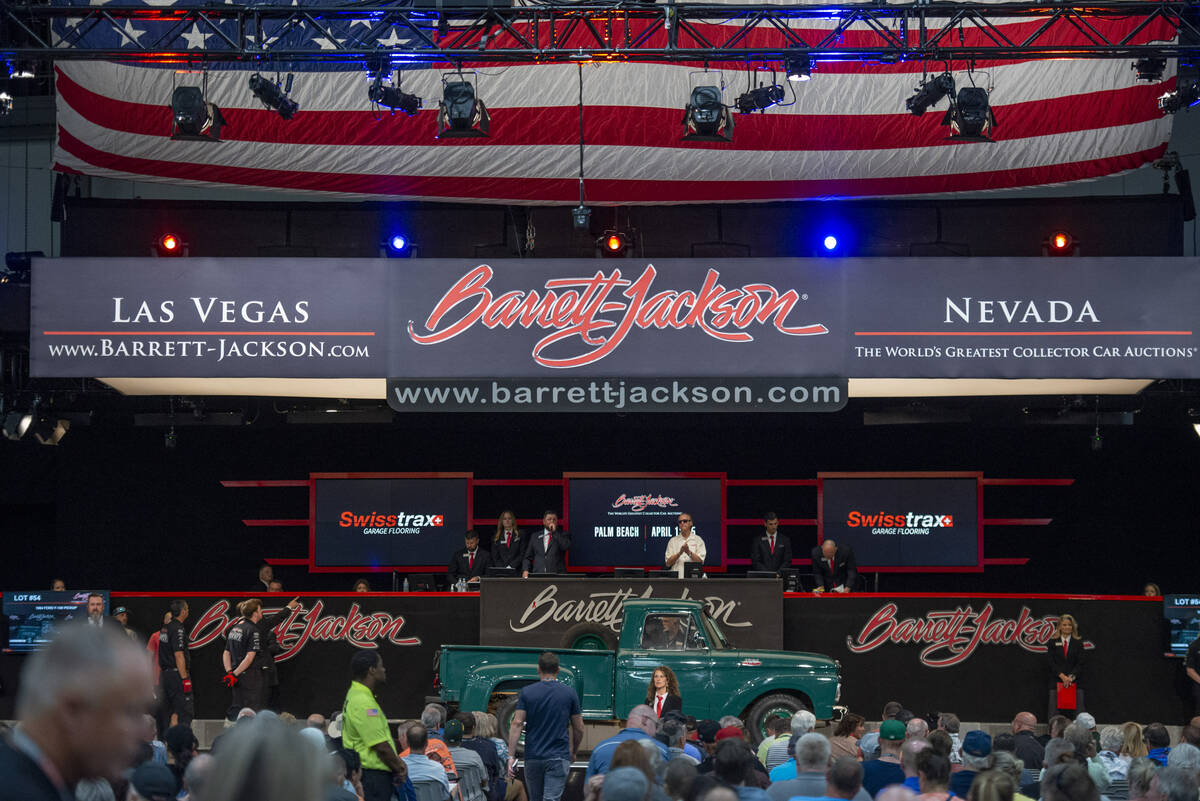 A 1964 Ford F-100 pickup goes up for sale at the opening day of the Barrett-Jackson car auction ...