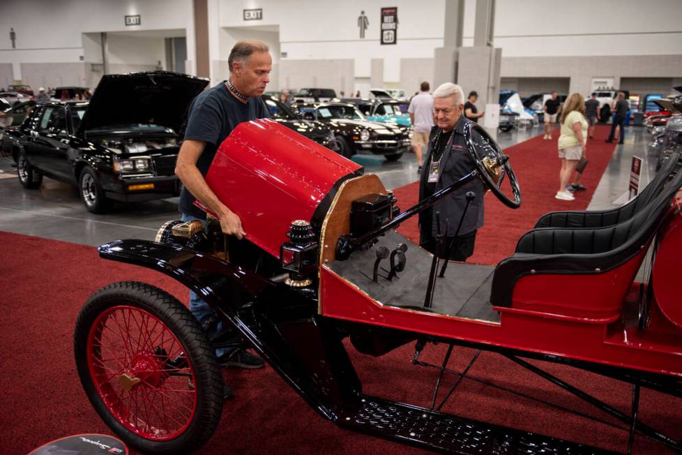 Patrick Leaderich, left, replaced the metal hood on his 1915 Model T before it goes up for auct ...