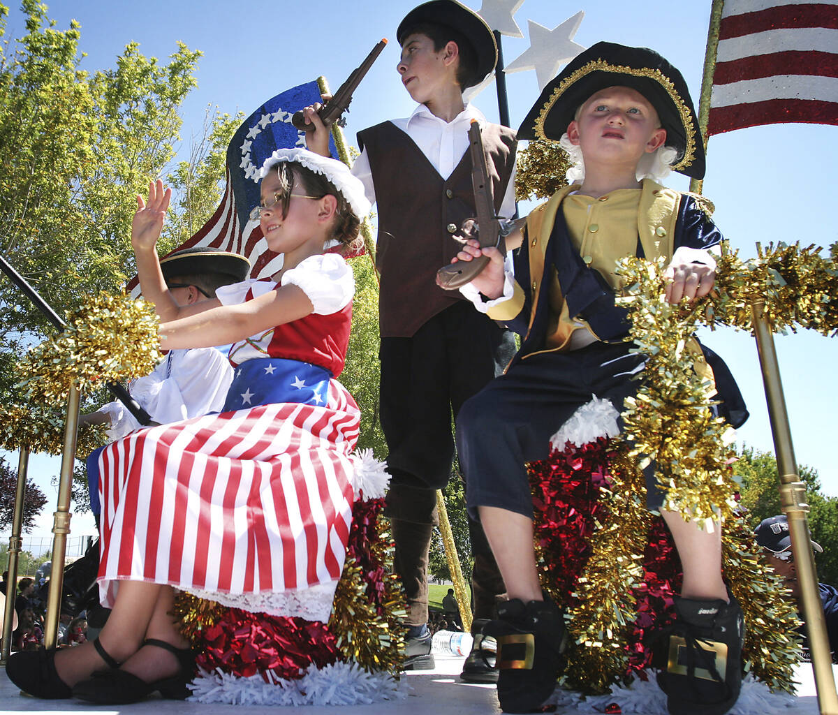 In this 2009 file photo, the founding fathers and mother enjoy their ride on a patriotic float ...