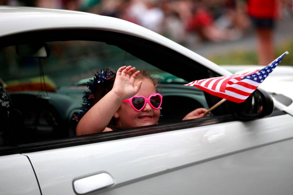 In this July 4, 2011, file photo, six-year-old Giovanna Vogt waves while riding in the 17th ann ...