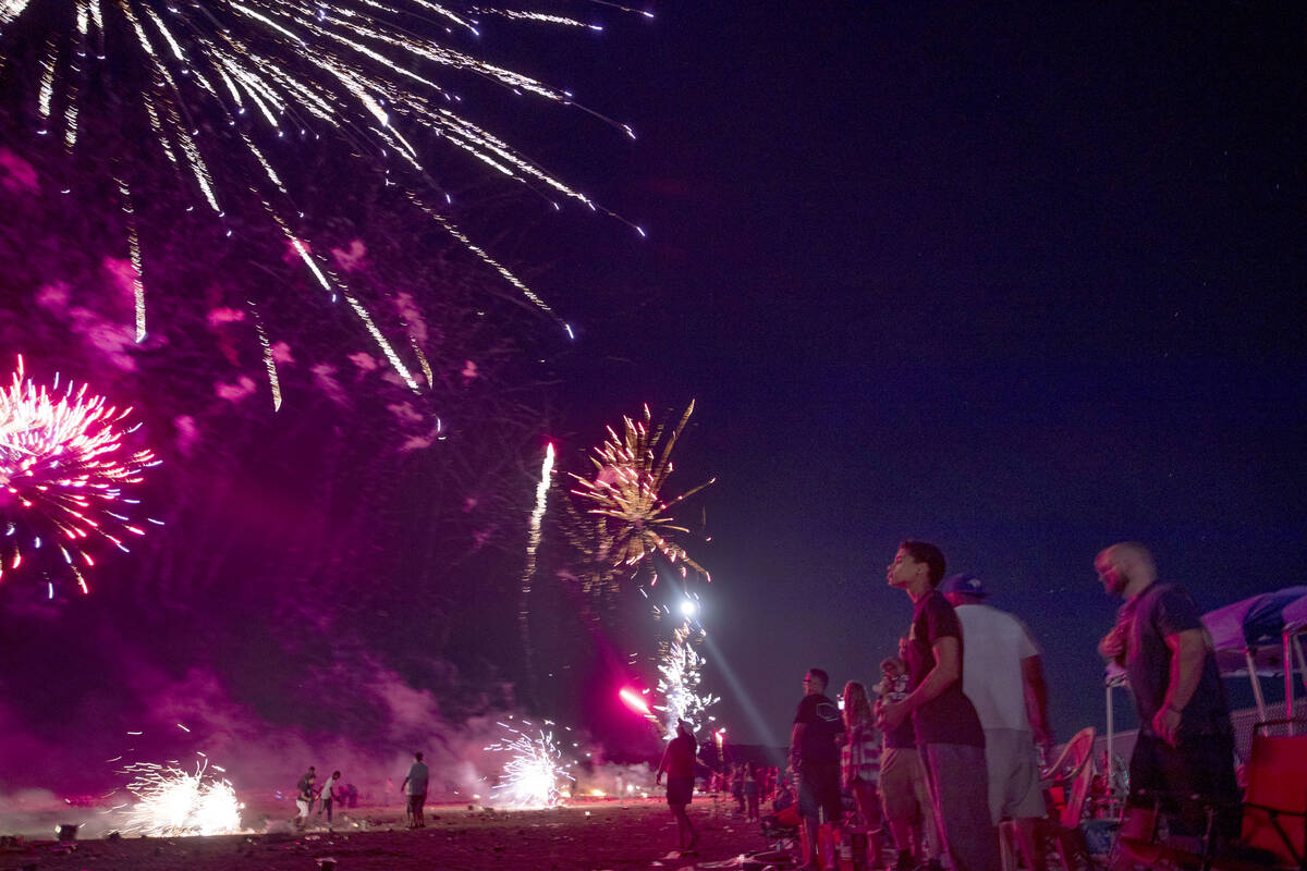 In this July 4, 2020, file photo, people light off fireworks near Moapa Paiute Travel Plaza dur ...