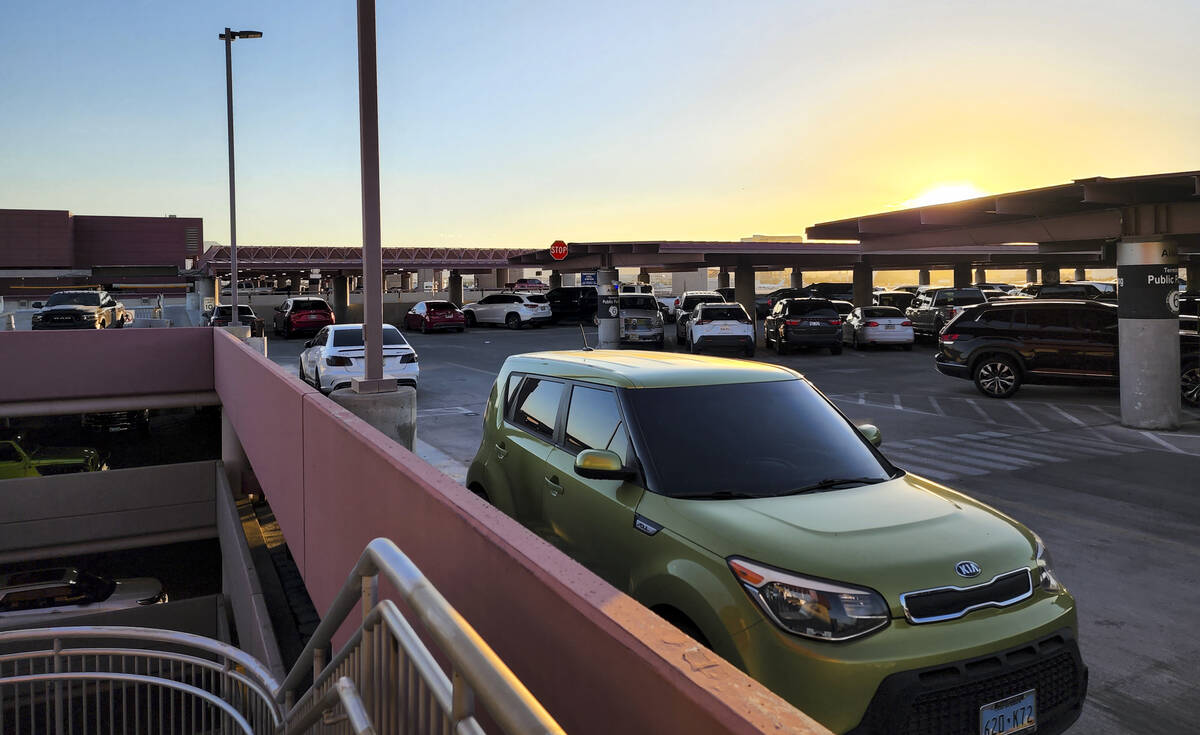 Cars fill up the top floor of long-term parking at Harry Reid International Airport on Wednesda ...