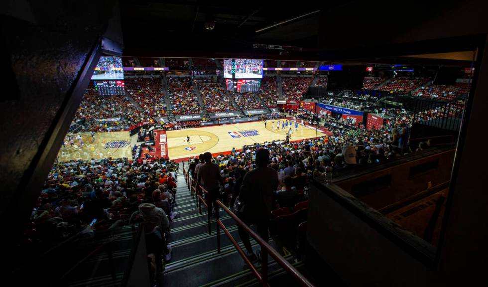 Basketball fans watch as the Detroit Pistons play the Oklahoma City Thunder during the first ha ...