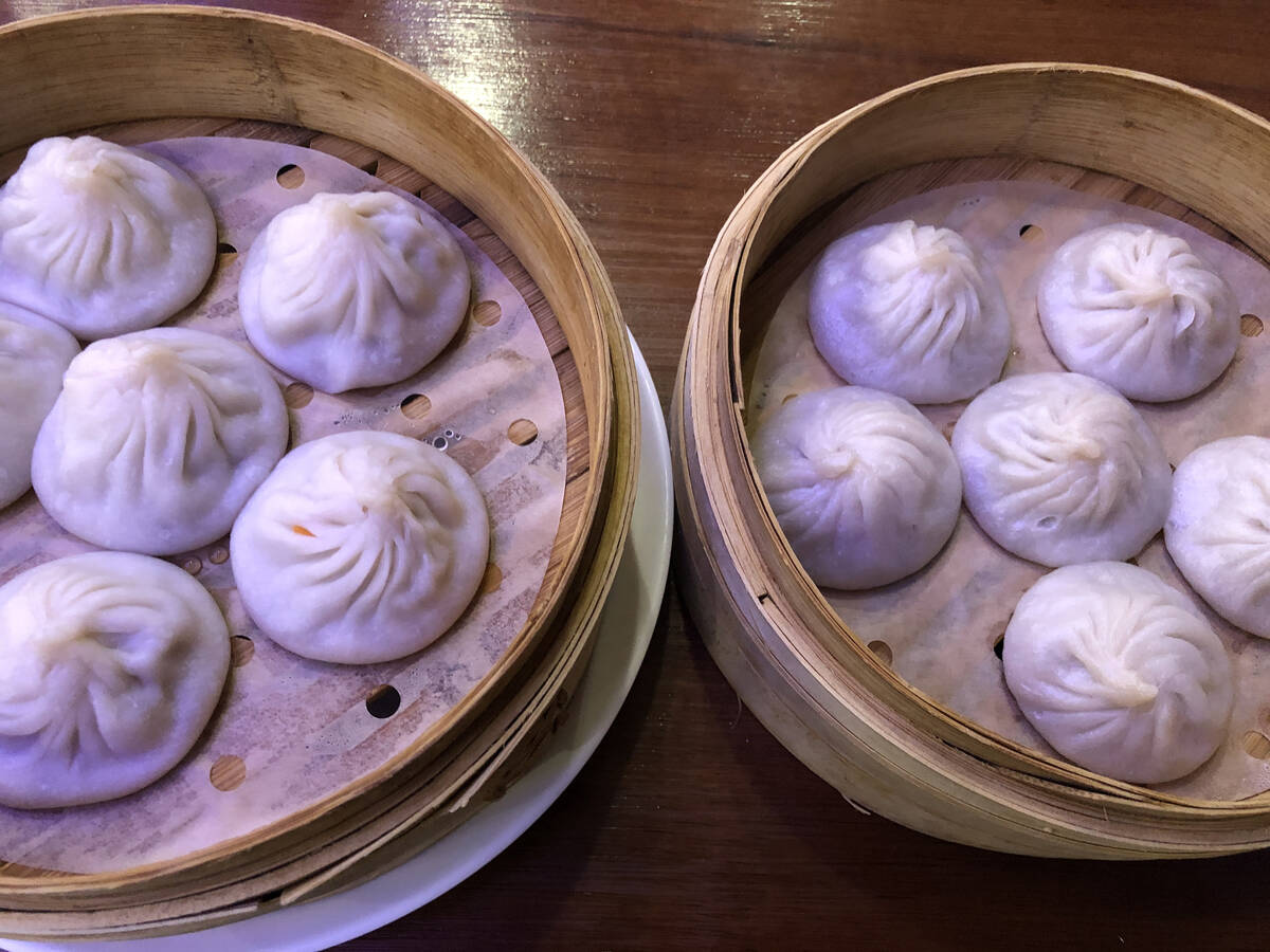 At Xiao Long Dumplings in the Chinatown Plaza, soup dumplings await diners who slurp out their ...